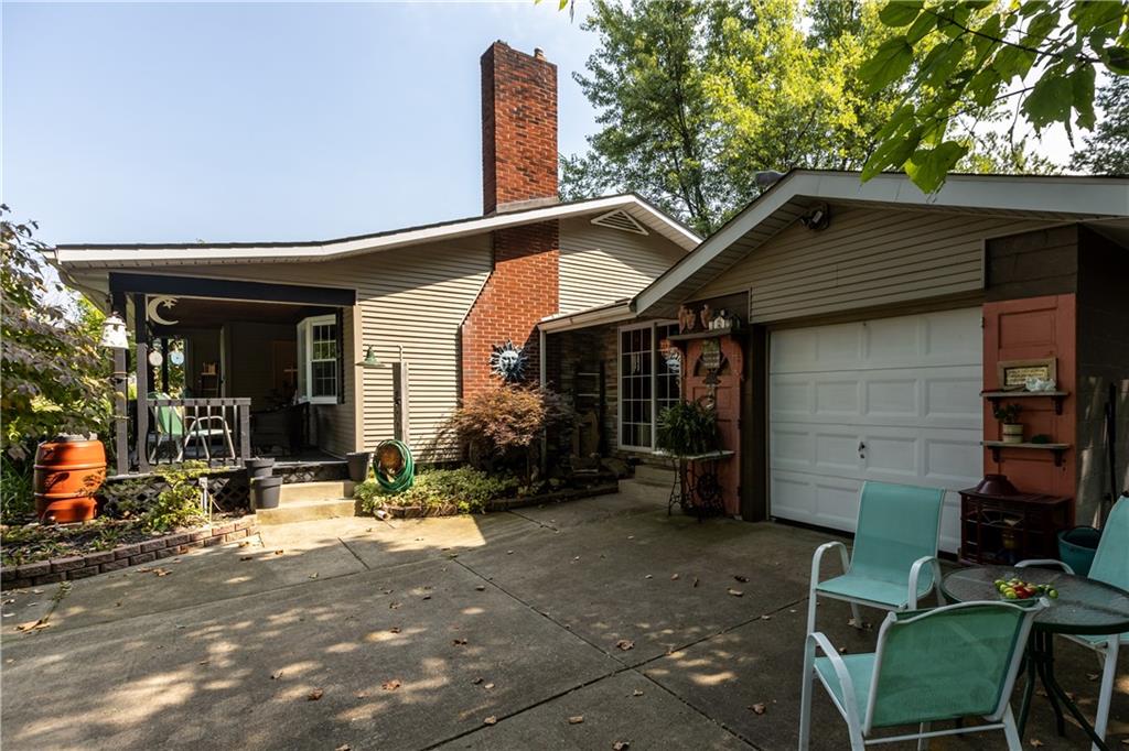 2172 Mercer Road New Brighton, PA 15066 - Photo 7 of 35 a backyard of a house with yard and outdoor seating