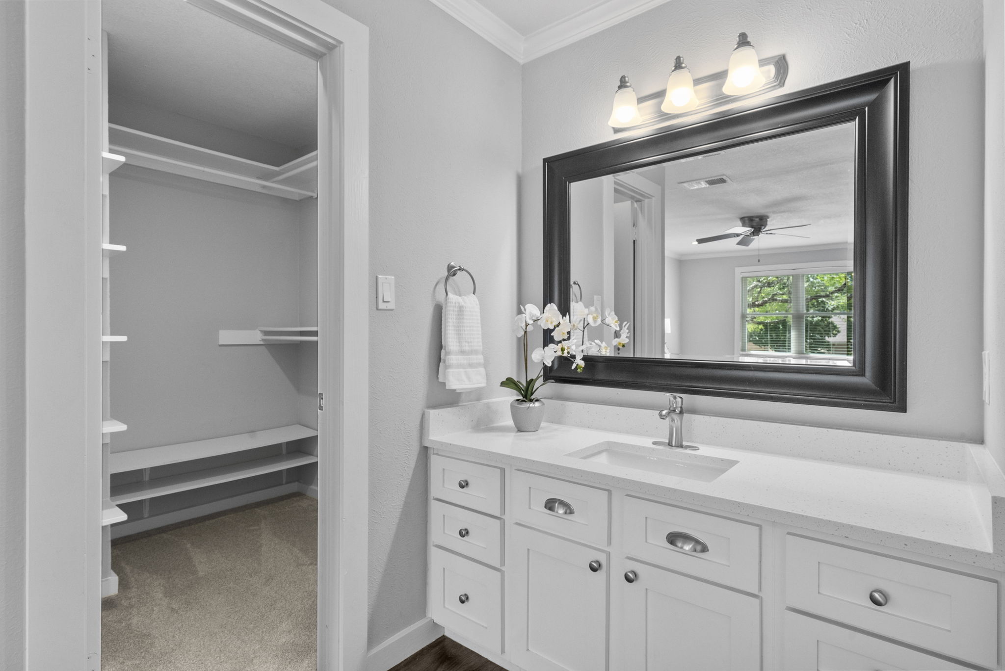 11405 Pyreneese Drive Austin, TX 78759 - Photo 17 of 37 a bathroom with a double vanity sink and a mirror