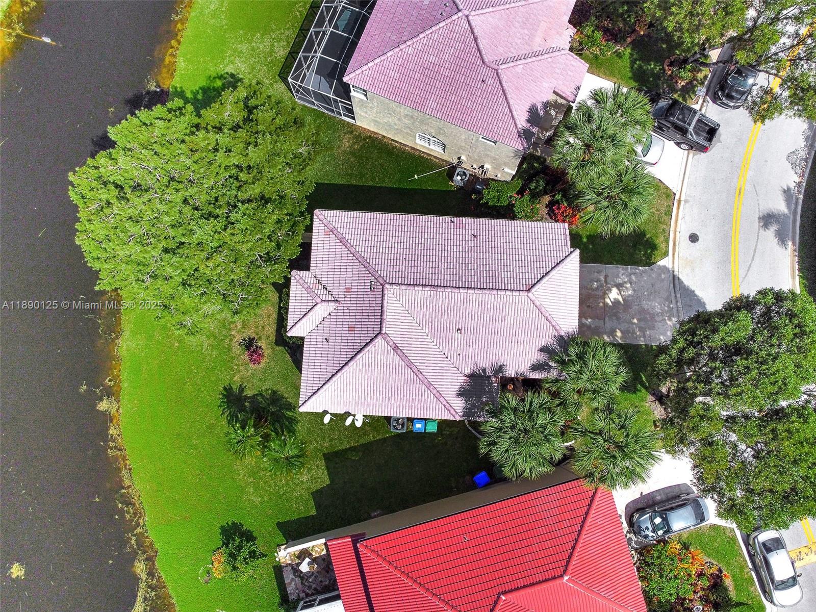 8713 Northwest 6th Court, Unit 8713 Coral Springs, FL 33071 - Photo 1 of 38 an aerial view of a house with garden space and street view