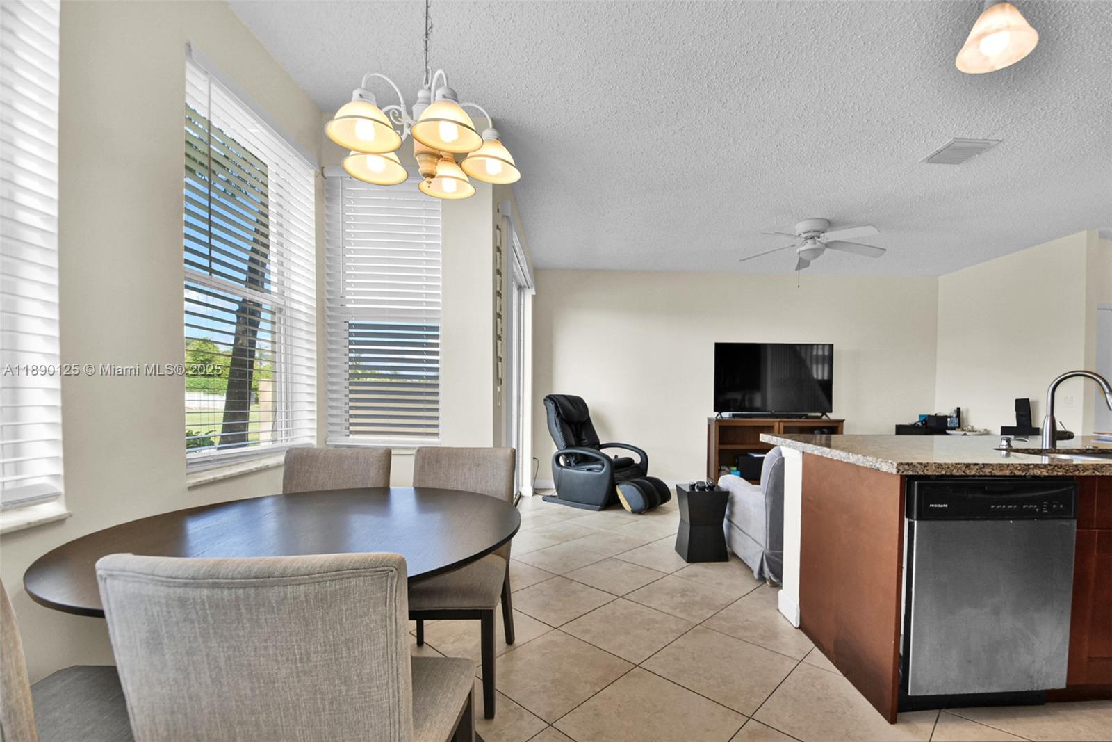 8713 Northwest 6th Court, Unit 8713 Coral Springs, FL 33071 - Photo 17 of 38 a view of a livingroom with workspace and a window