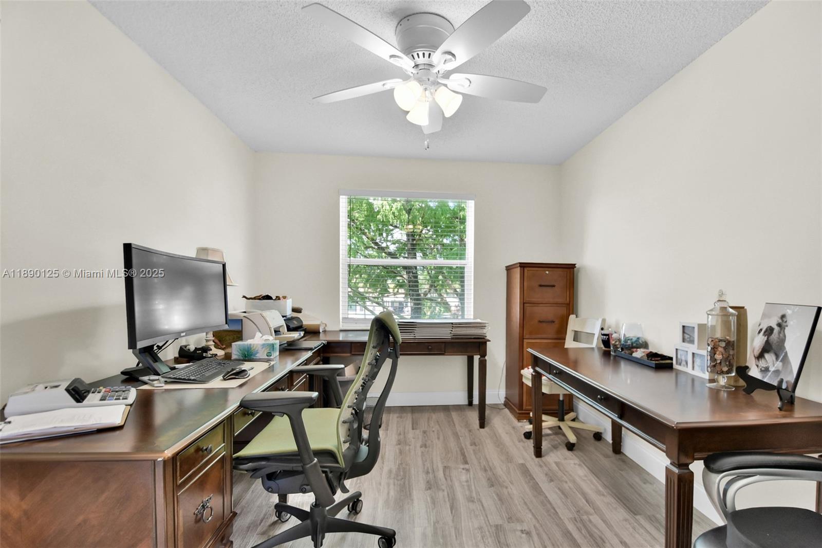 8713 Northwest 6th Court, Unit 8713 Coral Springs, FL 33071 - Photo 22 of 38 a view of a workspace with furniture and a window
