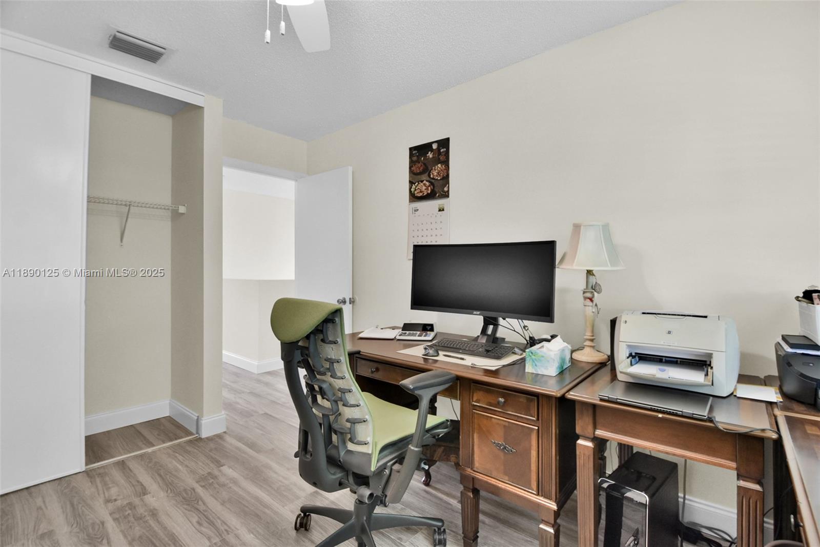 8713 Northwest 6th Court, Unit 8713 Coral Springs, FL 33071 - Photo 23 of 38 a view of a workspace with furniture and wooden floor