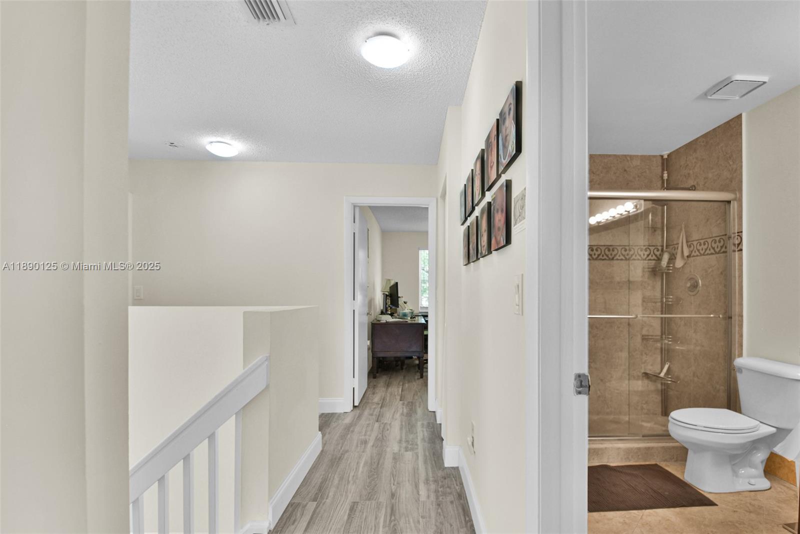 8713 Northwest 6th Court, Unit 8713 Coral Springs, FL 33071 - Photo 27 of 38 a bathroom with a toilet and a shower