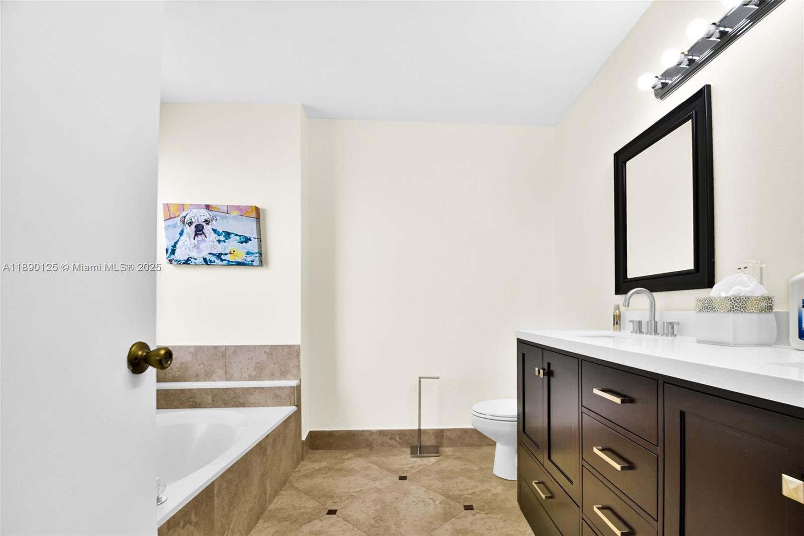 8713 Northwest 6th Court, Unit 8713 Coral Springs, FL 33071 - Photo 34 of 38 a bathroom with a tub sink and mirror