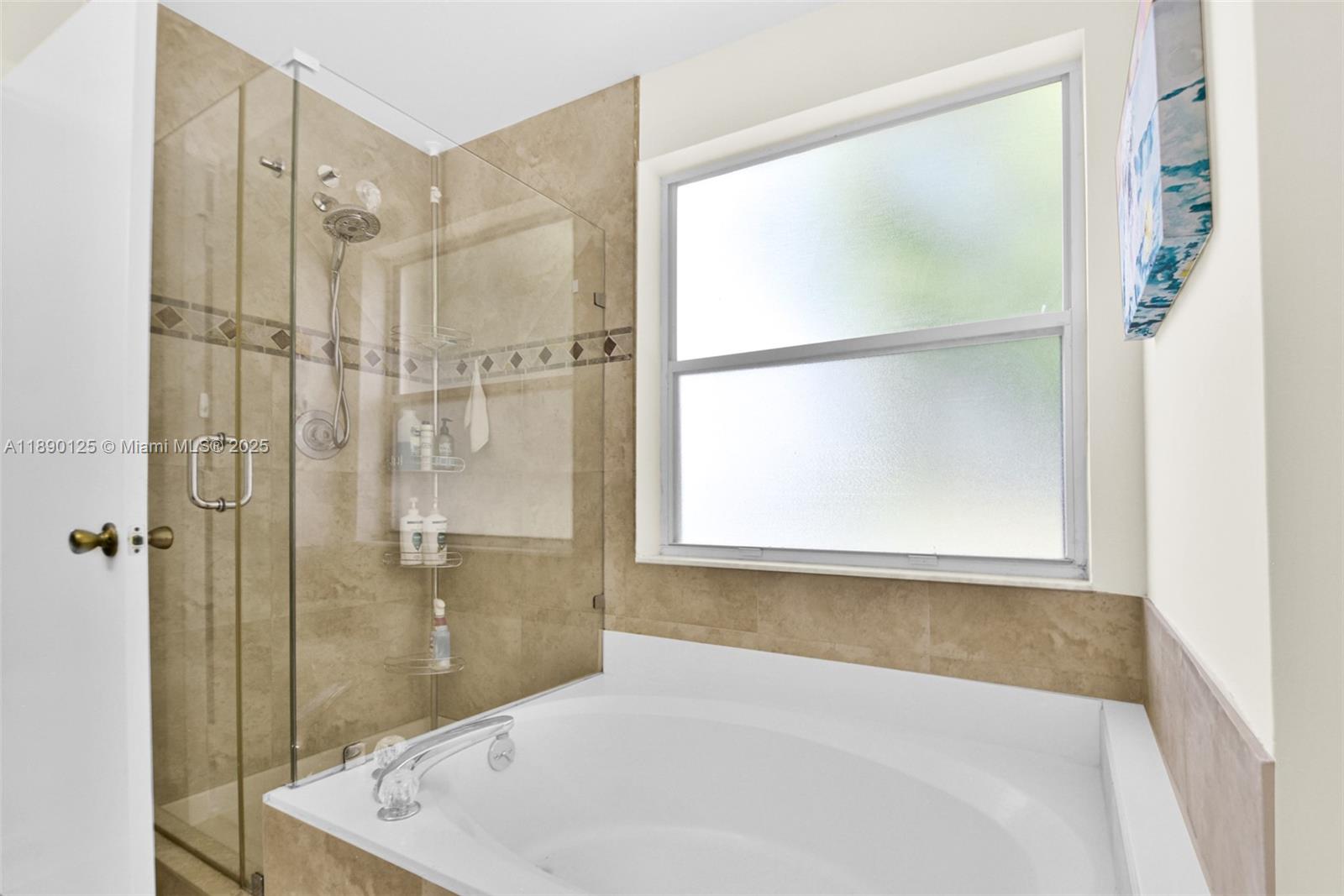 8713 Northwest 6th Court, Unit 8713 Coral Springs, FL 33071 - Photo 35 of 38 a bathroom with a bathtub and a shower