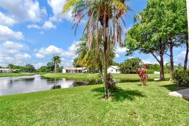 a view of a lake with a yard