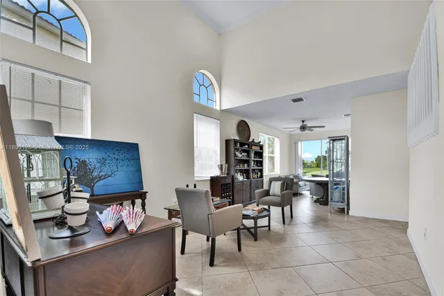 a view of a dining room with furniture and a rug