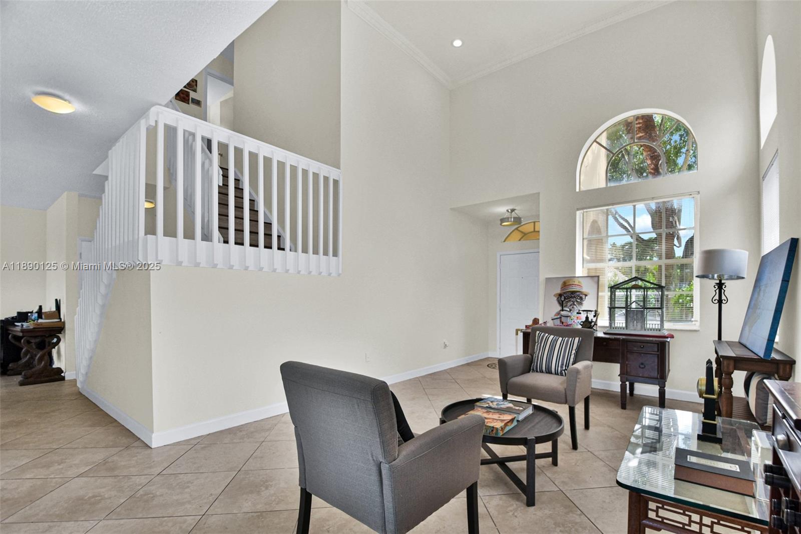 8713 Northwest 6th Court, Unit 8713 Coral Springs, FL 33071 - Photo 8 of 38 a living room with furniture and a large window