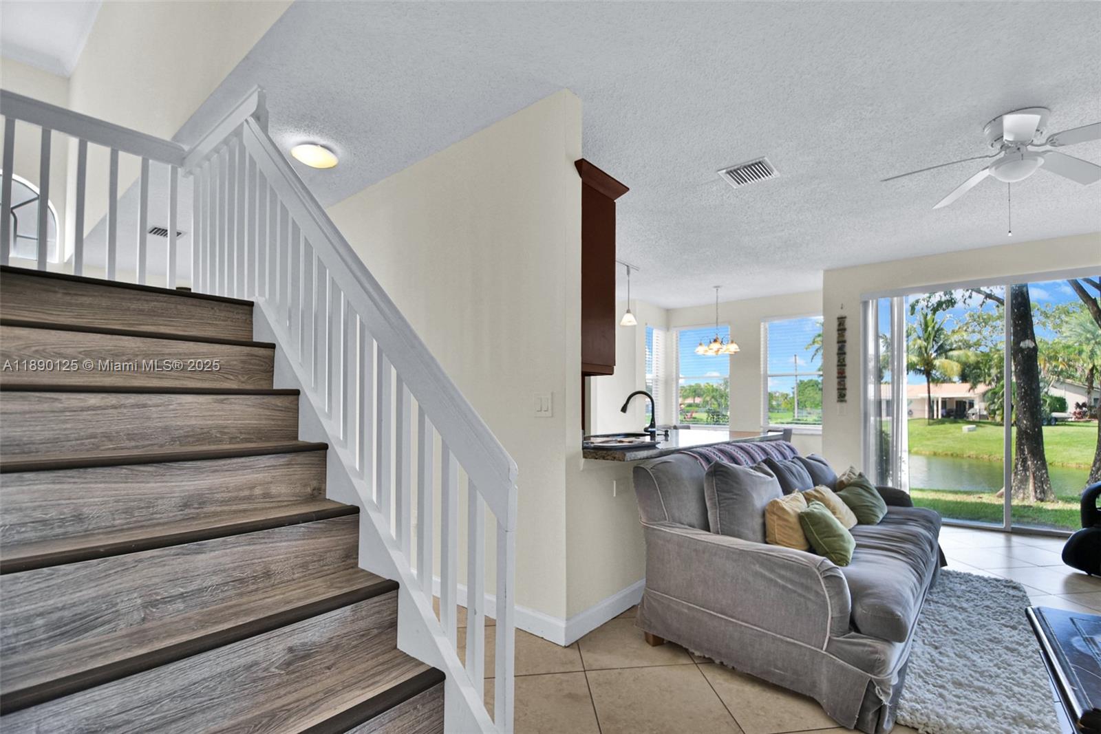 8713 Northwest 6th Court, Unit 8713 Coral Springs, FL 33071 - Photo 10 of 38 a view of entryway and hall with wooden floor