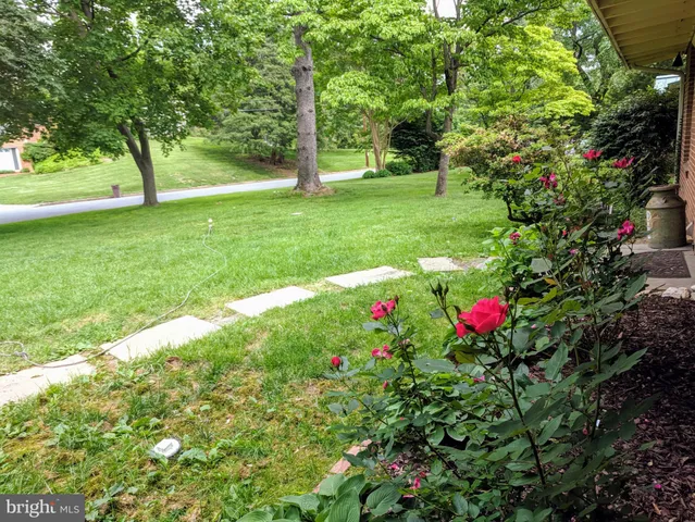 a front view of a house with a yard table and chairs