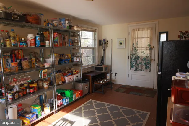 a room with lots of different kinds of fruit and vegetables