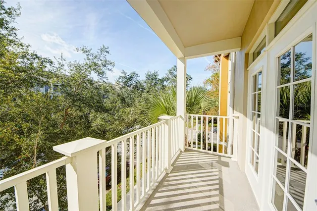 a view of a balcony with wooden floor