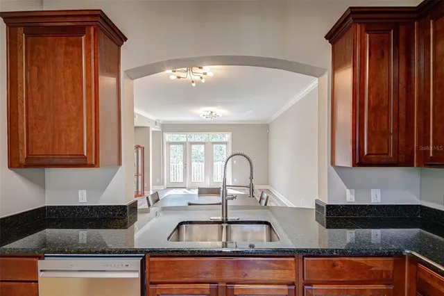 a kitchen with a sink and cabinets