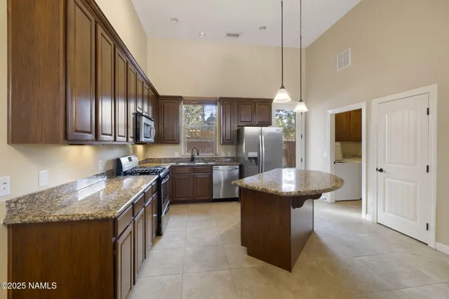 a view of staircase with white walls and windows