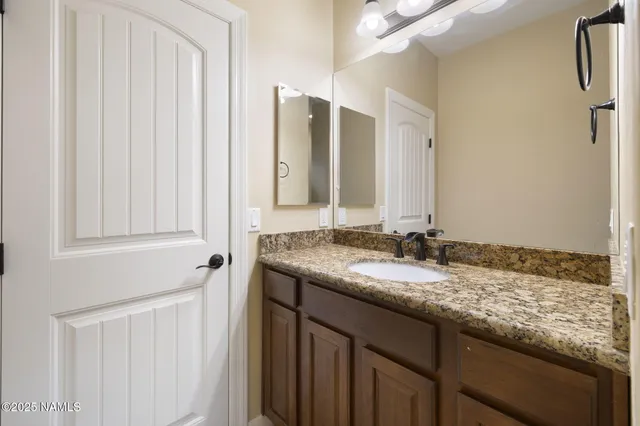 a bedroom with a bed and a lamp with window