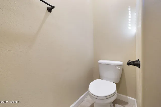 a view of empty room with a fireplace