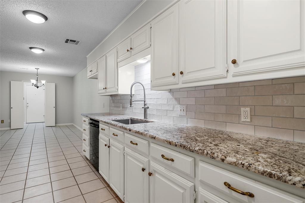 4108 Old Mill Road Waco, TX 76710 - Photo 12 of 40 a kitchen with a sink and cabinets
