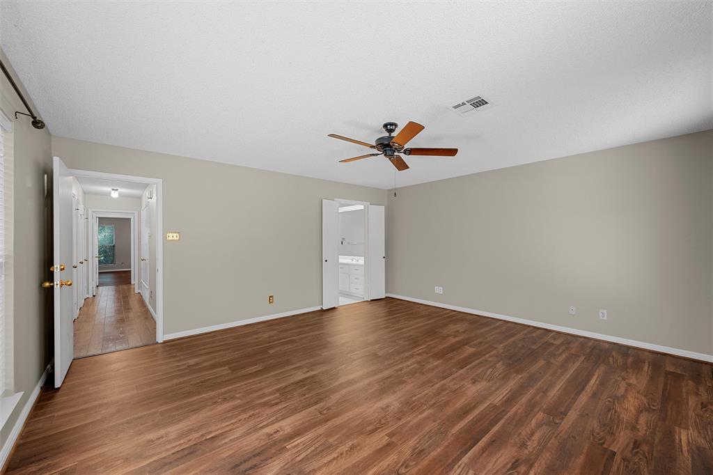 4108 Old Mill Road Waco, TX 76710 - Photo 18 of 40 a view of empty room with wooden floor and ceiling fan