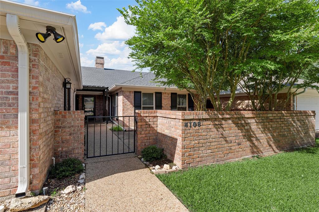 4108 Old Mill Road Waco, TX 76710 - Photo 2 of 40 a front view of a house with a garden