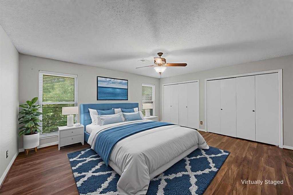 4108 Old Mill Road Waco, TX 76710 - Photo 23 of 40 a bedroom with a bed and a chandelier