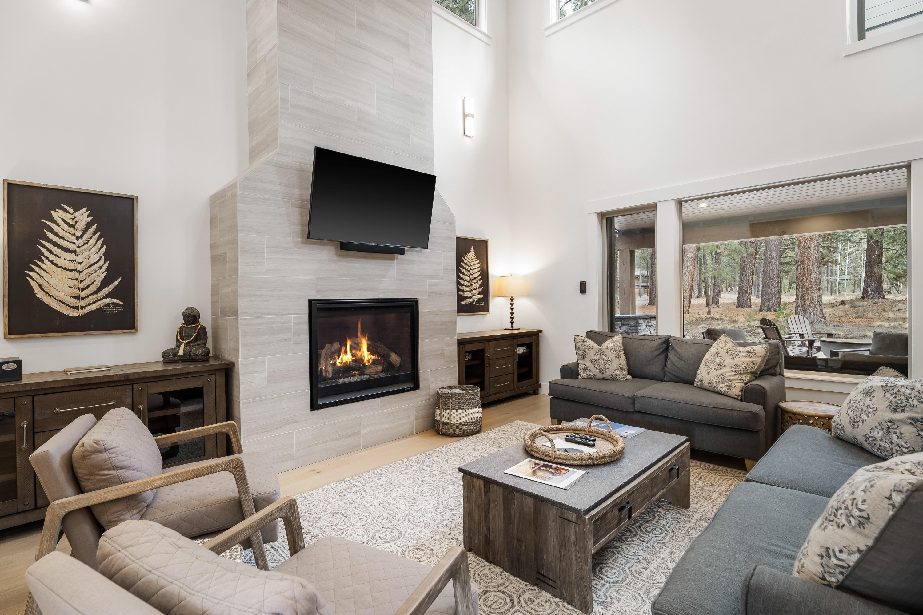 56302 Sable Rock Loop, Unit 255 Bend, OR 97707 - Photo 8 of 65 a living room with furniture a flat screen tv and a fireplace
