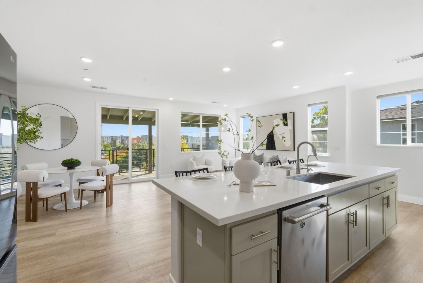 490 Trace Lane Hayward, CA 94544 - Photo 13 of 52 a open kitchen with stainless steel appliances granite countertop a sink and living room with wooden floor