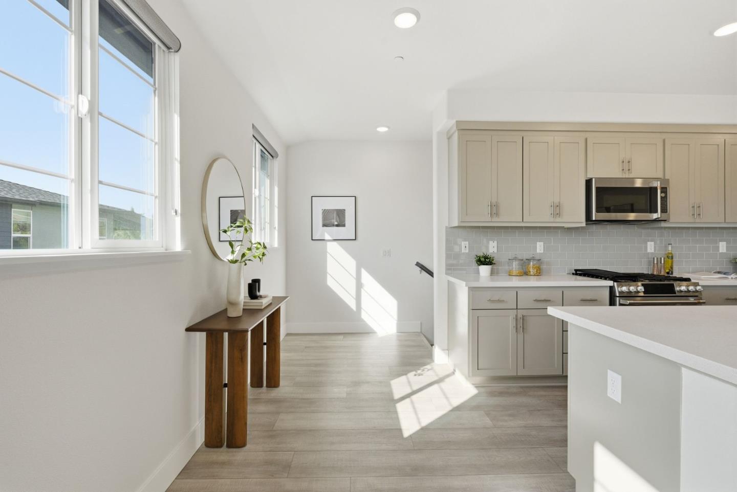 490 Trace Lane Hayward, CA 94544 - Photo 6 of 52 a kitchen with microwave a stove and white cabinets