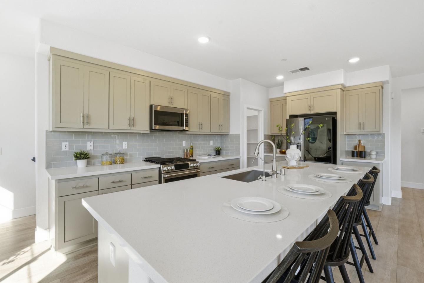 490 Trace Lane Hayward, CA 94544 - Photo 9 of 52 a kitchen with a stove a sink a dining table and chairs