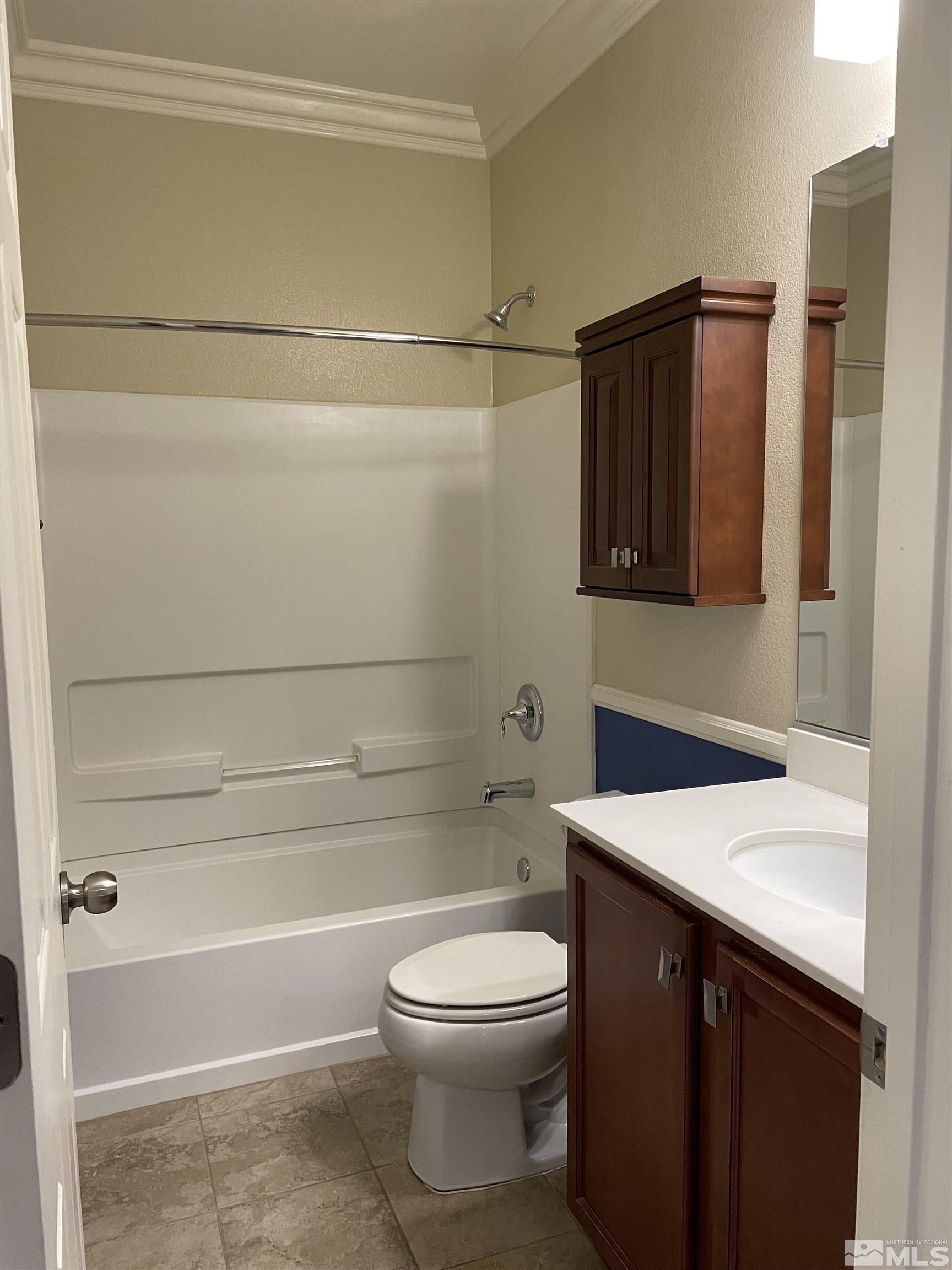 8945 Convair Way Reno, NV 89506 - Photo 24 of 26 a bathroom with a sink a toilet and shower