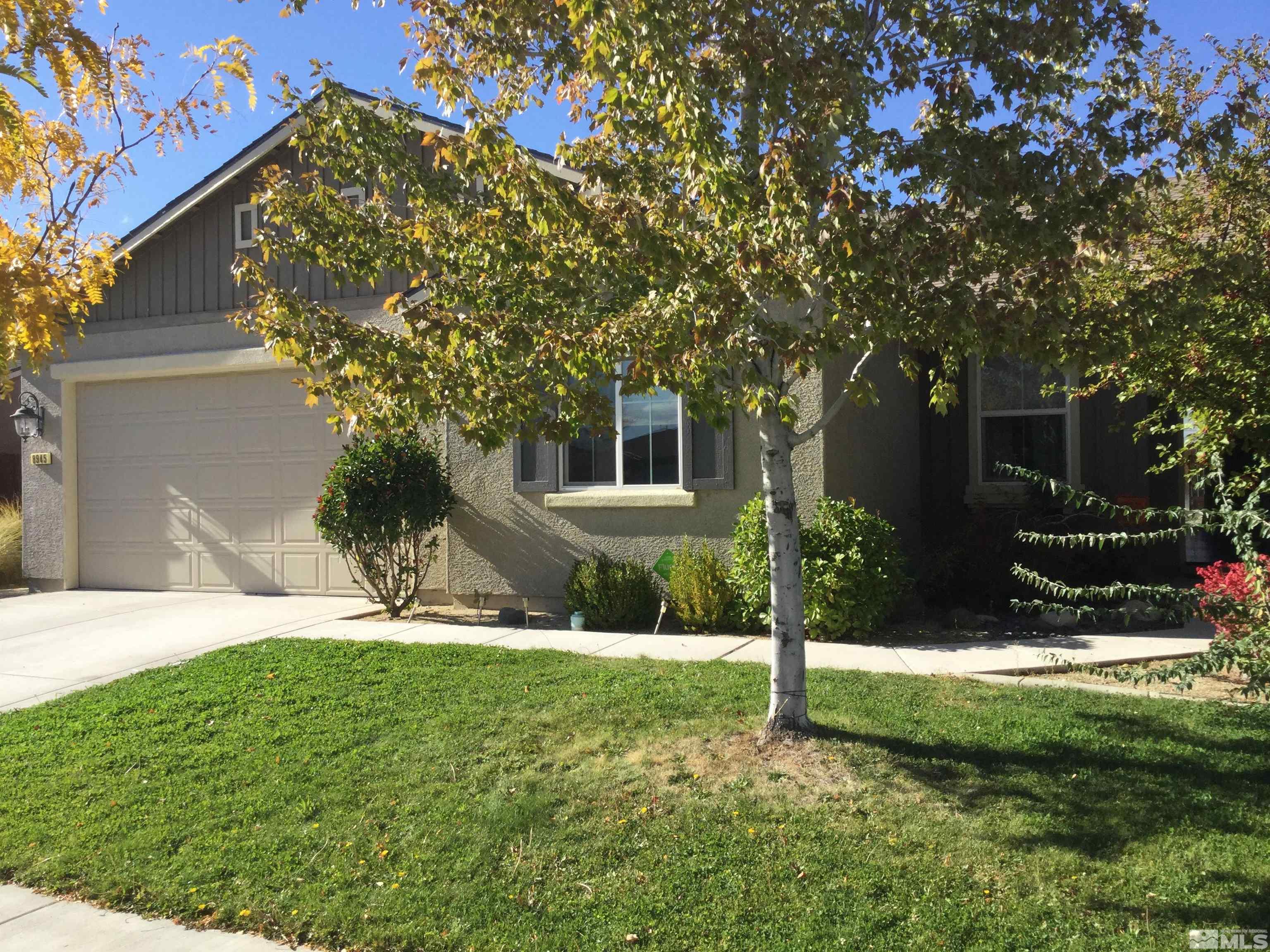 8945 Convair Way Reno, NV 89506 - Photo 3 of 26 a view of a house with a yard