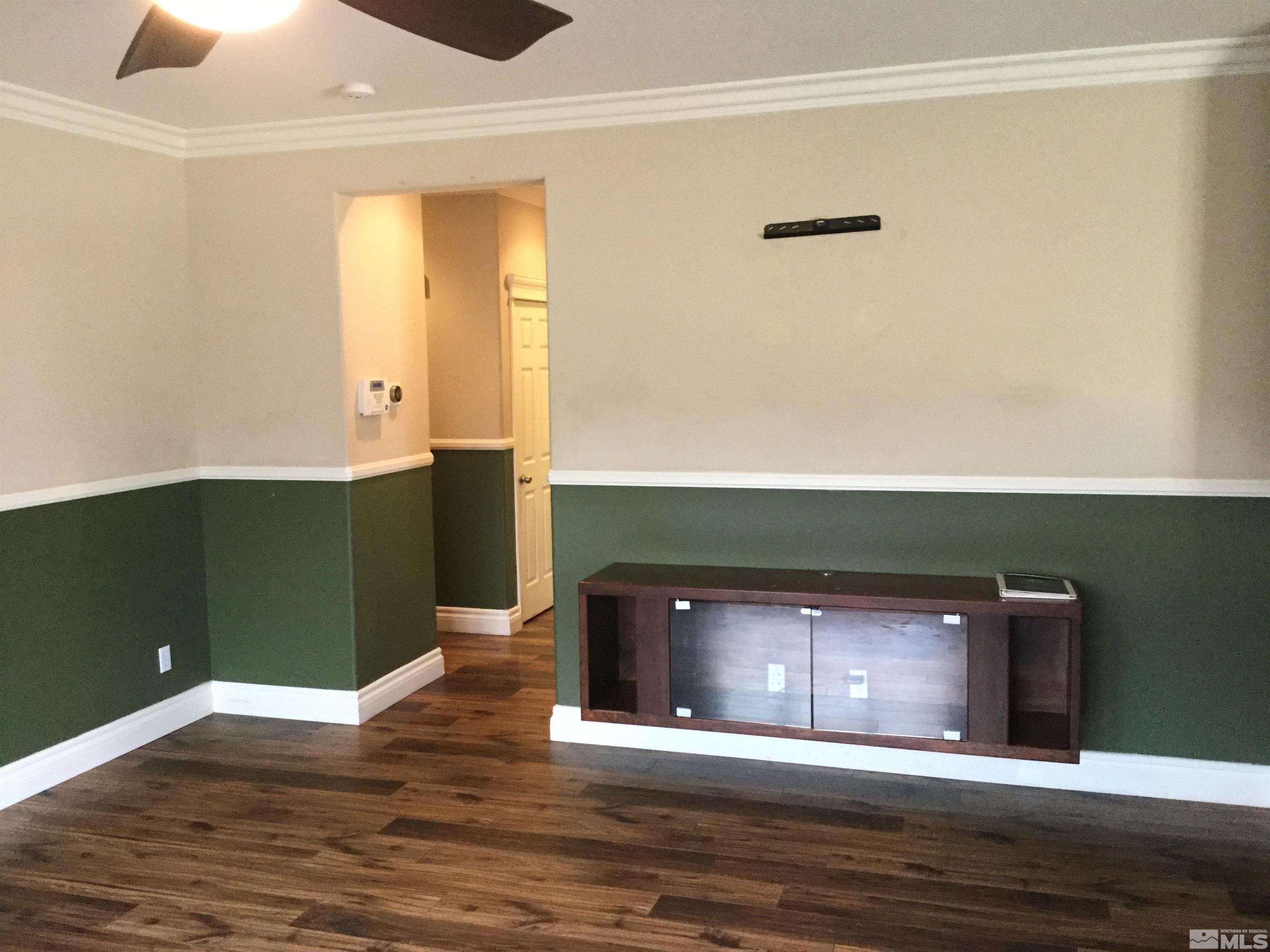 8945 Convair Way Reno, NV 89506 - Photo 5 of 26 a view of a livingroom with wooden floor