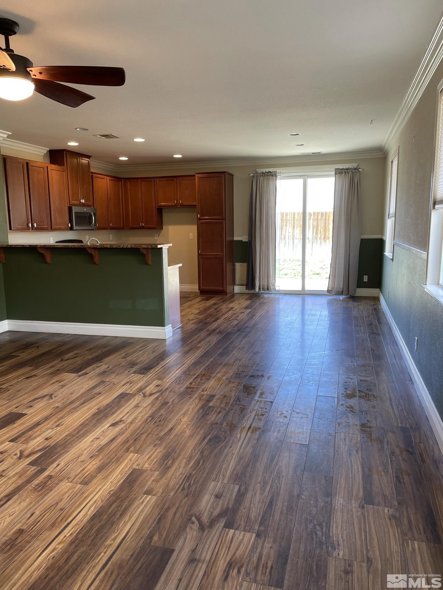 8945 Convair Way Reno, NV 89506 - Photo 6 of 26 a view of kitchen with wooden floor