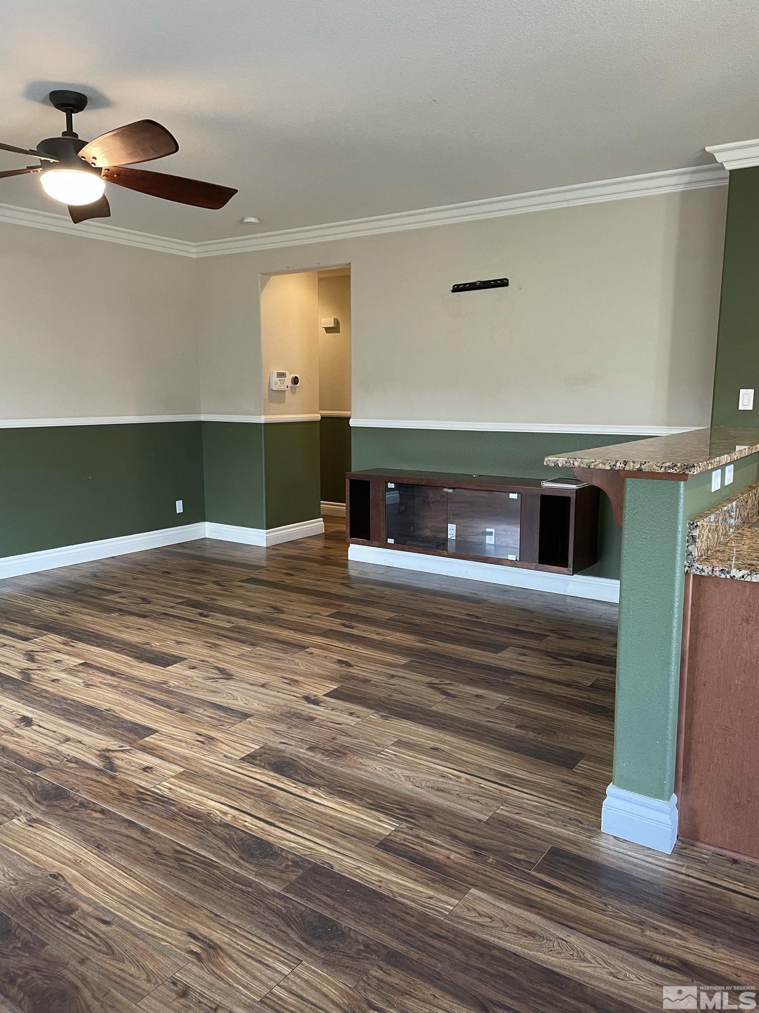 8945 Convair Way Reno, NV 89506 - Photo 7 of 26 a view of a livingroom with wooden floor