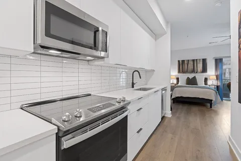 a kitchen with a stove and a microwave