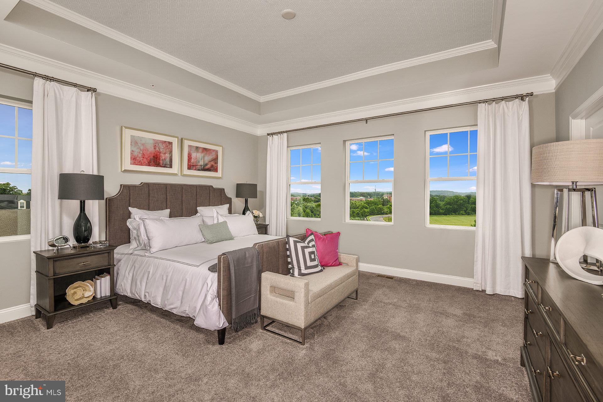 7103 Delegate Place Frederick, MD 21703 - Photo 11 of 23 a spacious bedroom with a bed and a large window