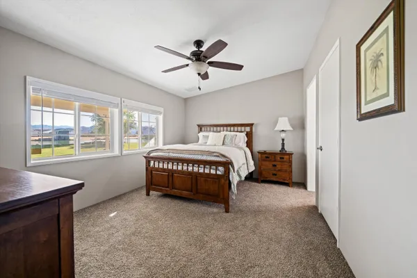 a bedroom with a bed and a window