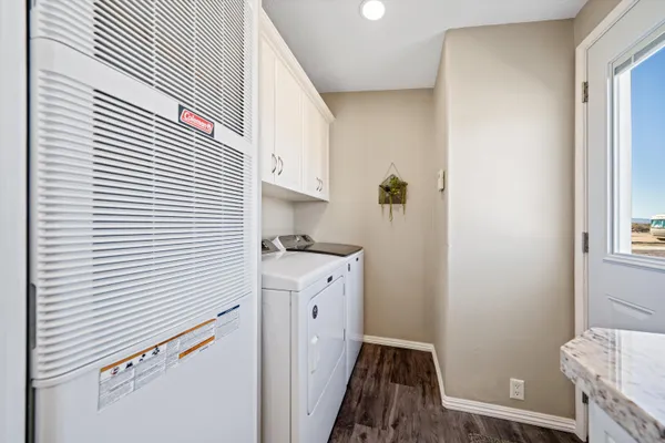 a kitchen with a sink a refrigerator and window