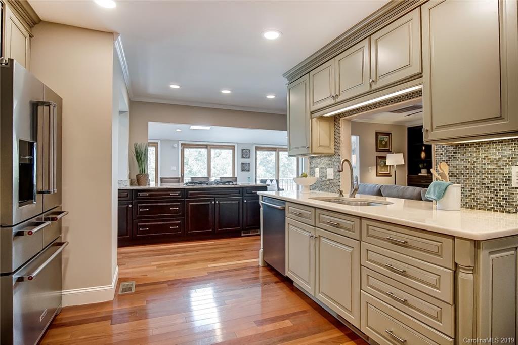 8016 Rising Meadow Road Charlotte, NC 28277 - Photo 14 of 47 a large kitchen with stainless steel appliances and cabinets