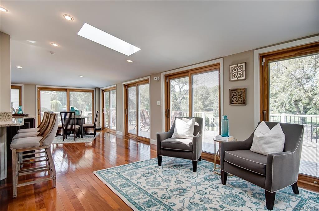 8016 Rising Meadow Road Charlotte, NC 28277 - Photo 22 of 47 a living room with furniture large window and wooden floor