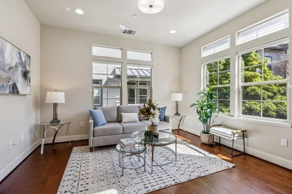 a living room with furniture and a large window
