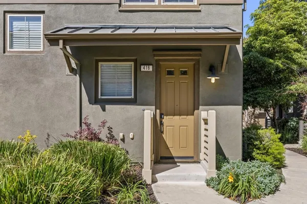 a front view of a house with garden