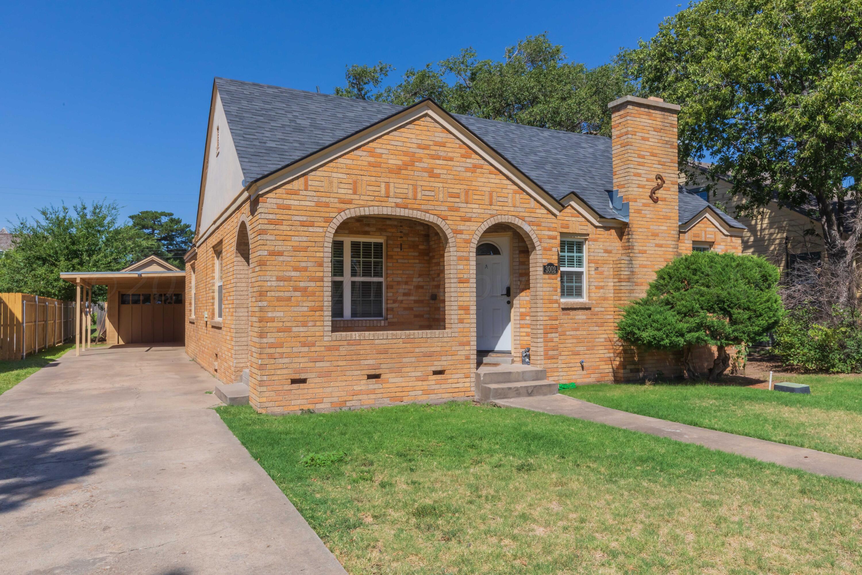 3002 South Polk Street Amarillo, TX 79109 - Photo 2 of 36 a view of a house with a yard