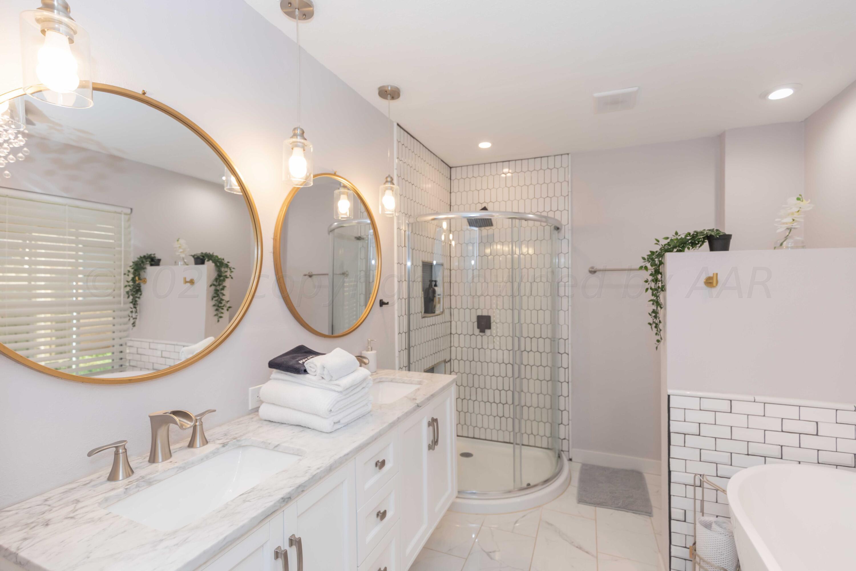 3002 South Polk Street Amarillo, TX 79109 - Photo 21 of 36 a bathroom with a sink mirror toilet and shower