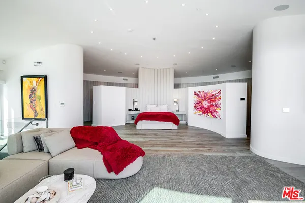a room with furniture and flat screen tv