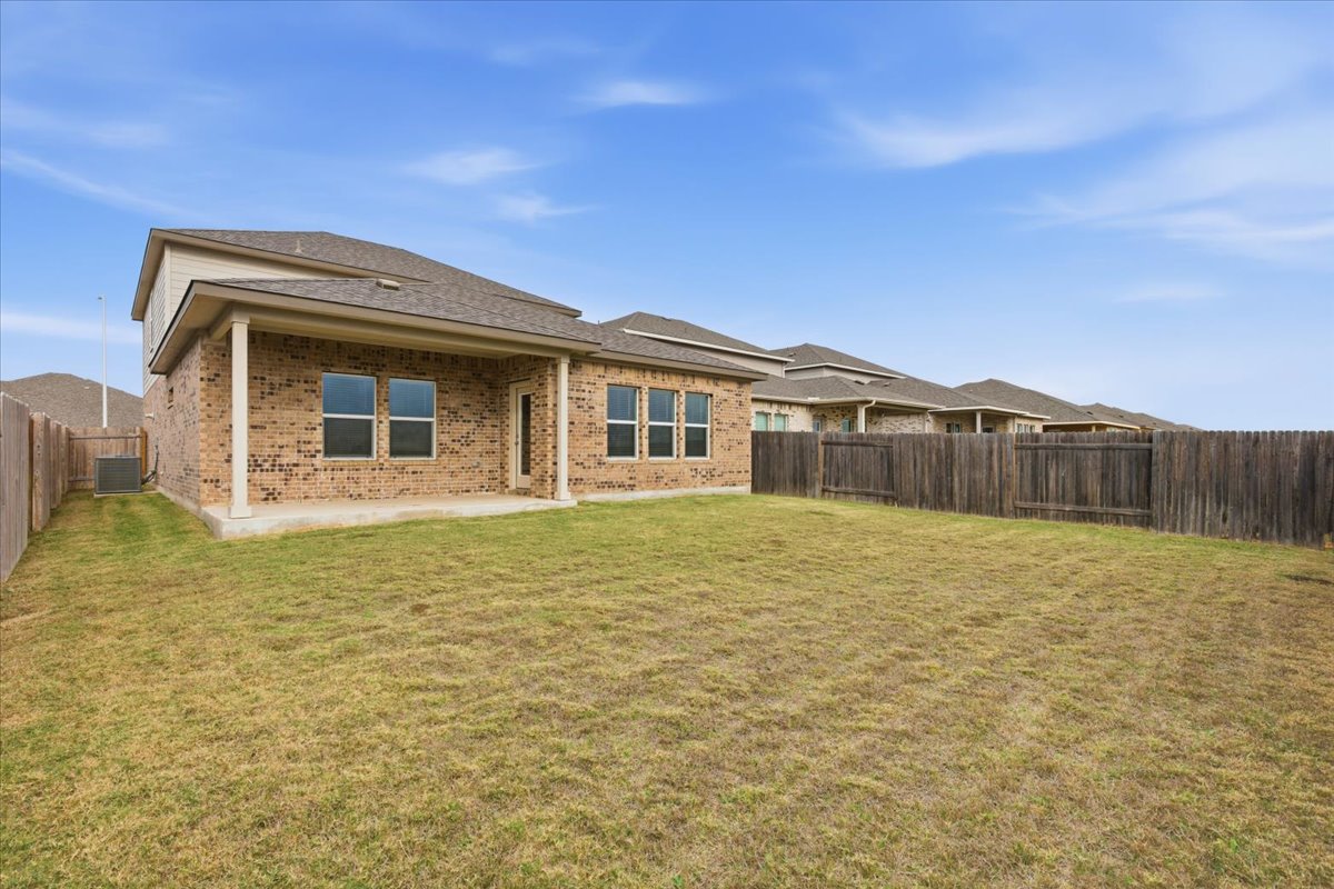 17705 Prairie Land Way Manor, TX 78653 - Photo 22 of 29 Private fenced backyard with covered patio