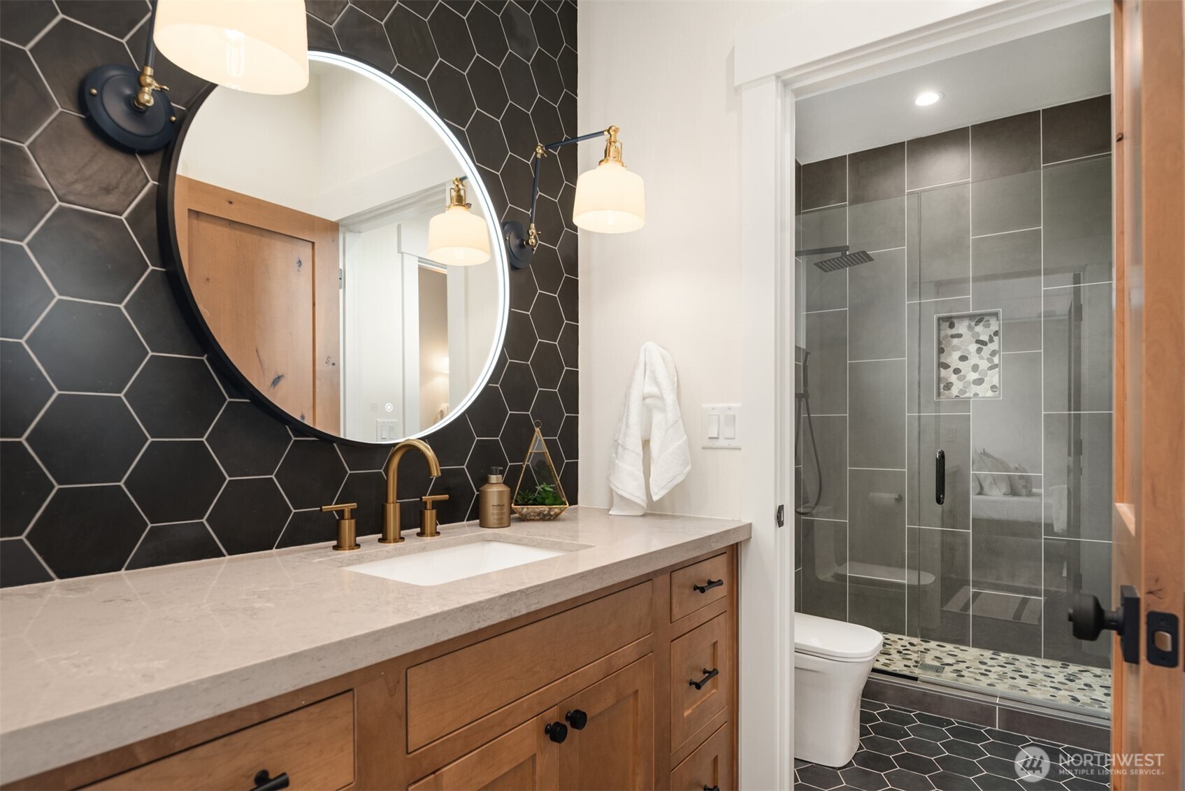 33310 Northeast 95th Place Carnation, WA 98014 - Photo 22 of 40 a bathroom with a sink mirror toilet and shower