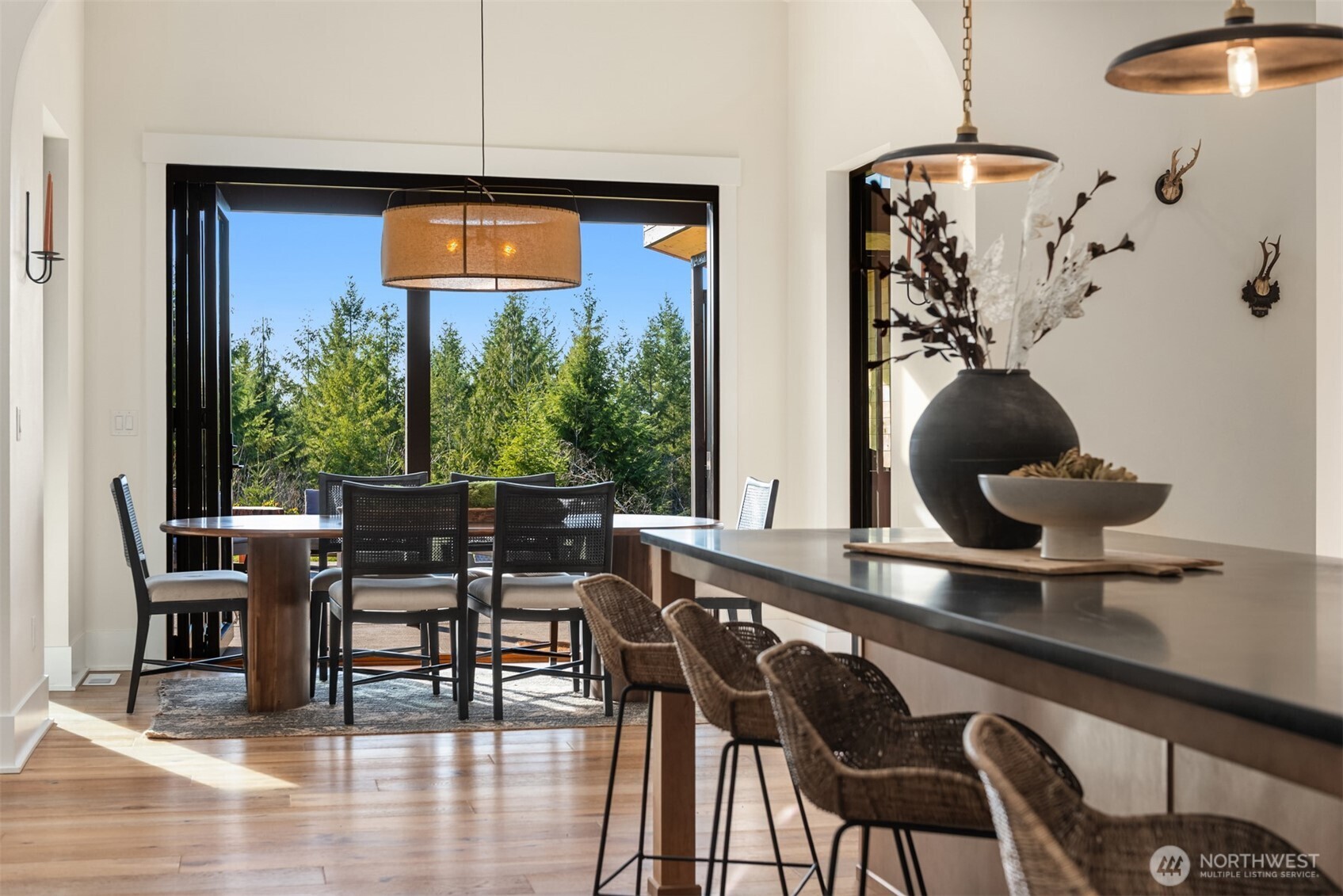33310 Northeast 95th Place Carnation, WA 98014 - Photo 10 of 40 a view of a dining room with furniture and wooden floor