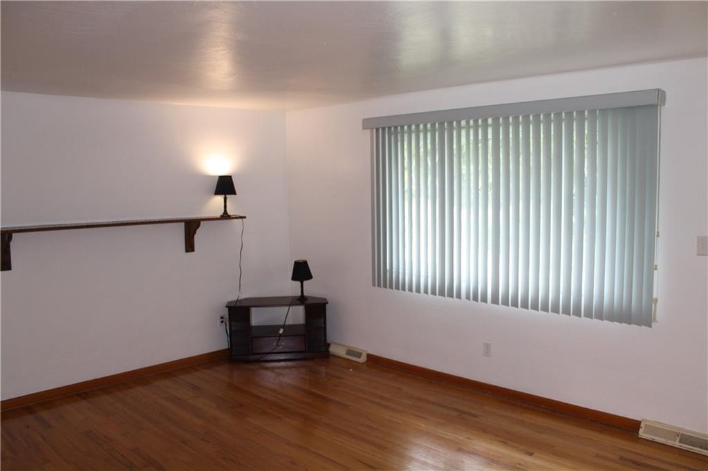 11 6th Way Russellton, PA 15076 - Photo 9 of 20 an empty room with wooden floor and windows