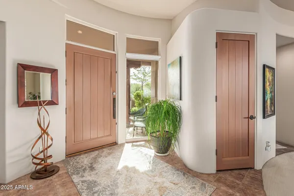 a dining room with furniture window and wooden floor