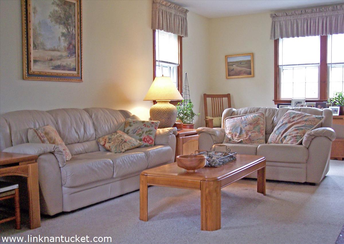 132 Surfside Road Nantucket, MA 02554 - Photo 5 of 17 a living room with furniture a window and a lamp